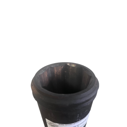 A black cup sitting on top of a table.