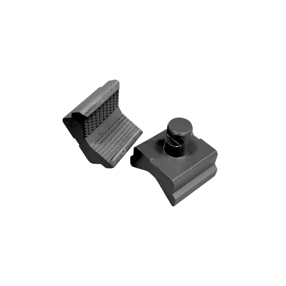 A pair of black plastic clips for a camera.