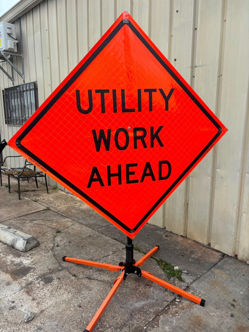 Utility Work Ahead roll-up warning sign with portable stand