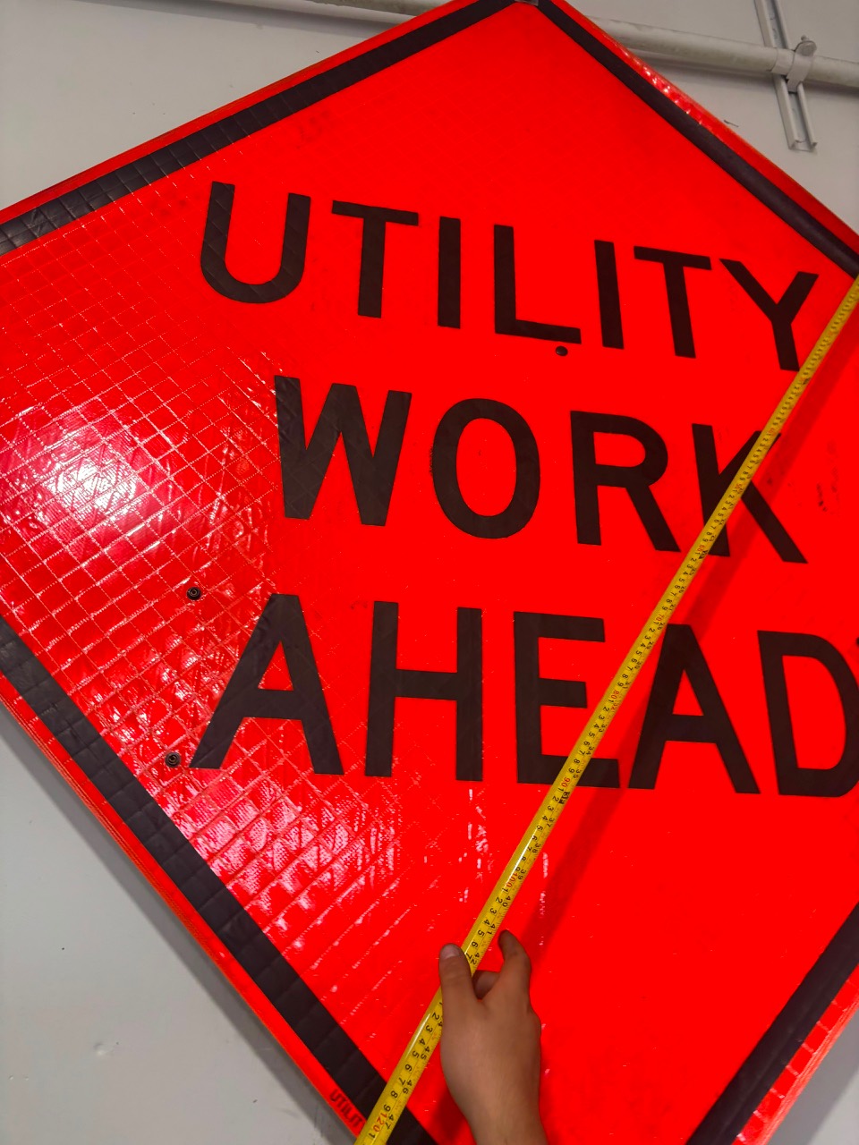 Utility Work Ahead roll-up warning sign with portable stand